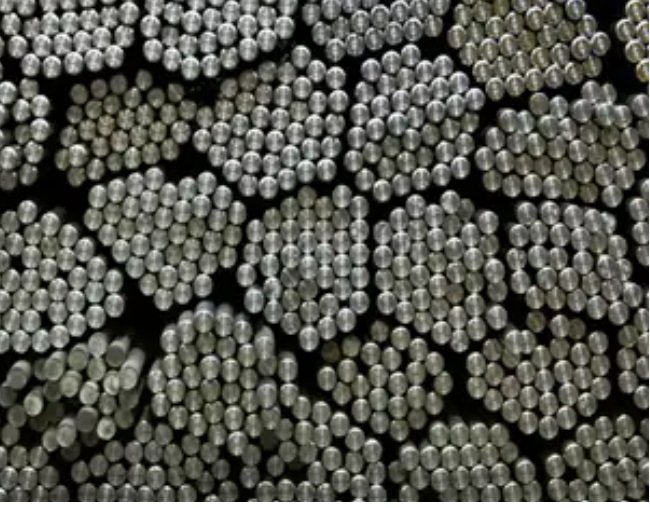  Inconel 718 nickel-based superalloy bar stock, cut to length, awaiting forging.